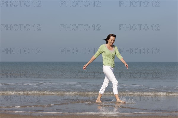 Woman on beach. Photo : Jan Scherders