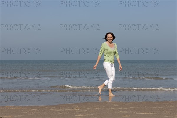 Woman on beach. Photo : Jan Scherders