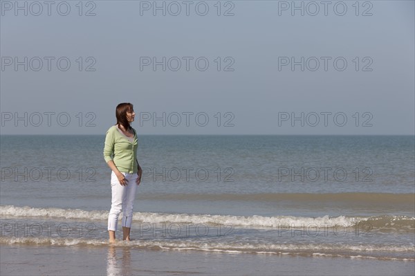 Woman on beach. Photo : Jan Scherders