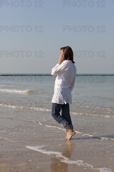 Woman on beach. Photo : Jan Scherders