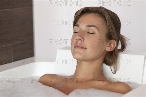 Woman taking bath. Photo : Jan Scherders