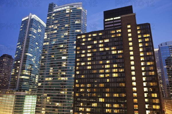 USA, Illinois, Chicago, Office buildings at night. Photo: Henryk Sadura