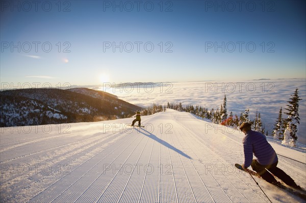 USA, Montana, Whitefish, Tourists on ski slope. Photo: Noah Clayton