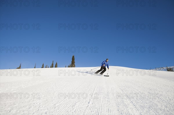 USA, Montana, Whitefish, Tourist on ski slope. Photo : Noah Clayton