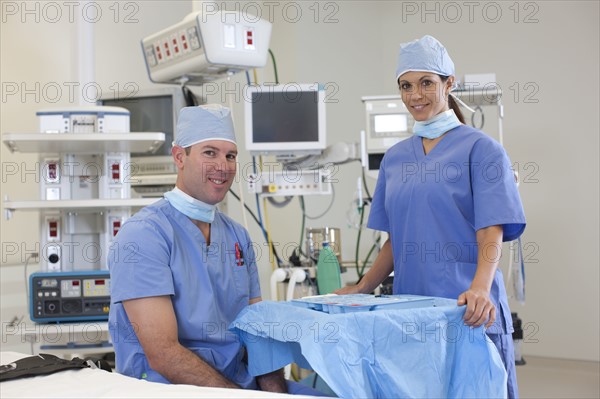 Portrait of male and female surgeons in operating room. Photo: db2stock