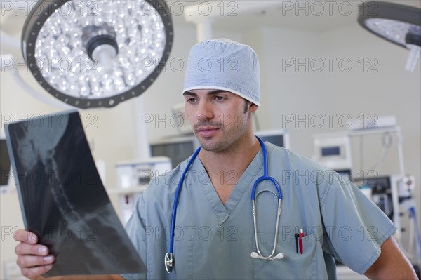 Doctor looking at x-ray. Photo : db2stock