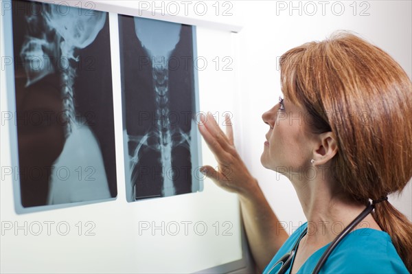 Doctor looking at x-ray. Photo : db2stock