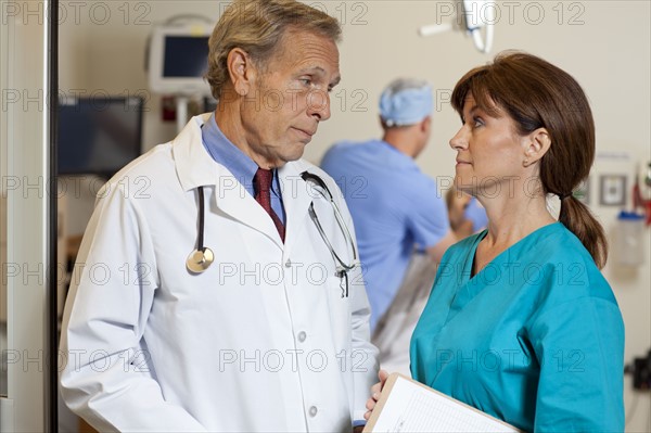 Doctors looking at each other. Photo : db2stock