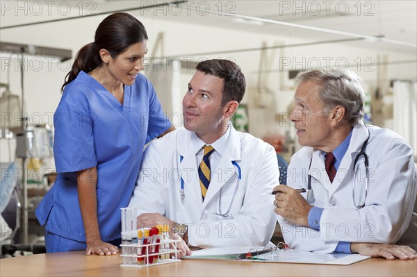 Female surgeon and two male doctors in hospital. Photo: db2stock