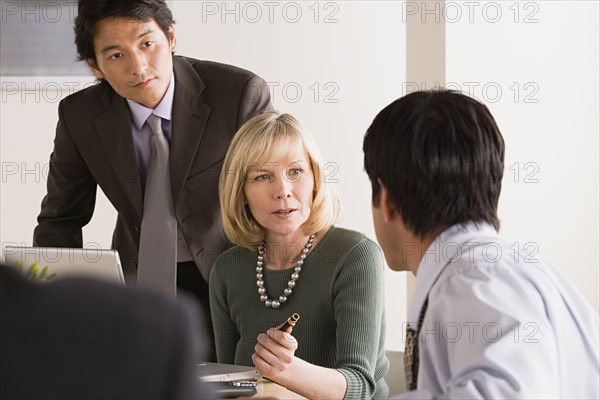 Business people at meeting. Photo : Rob Lewine