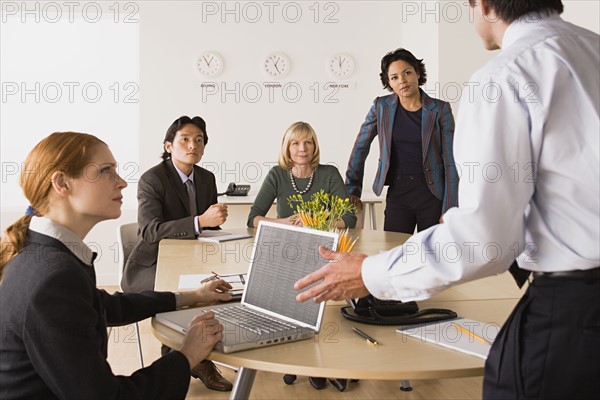 Business people at meeting. Photo : Rob Lewine