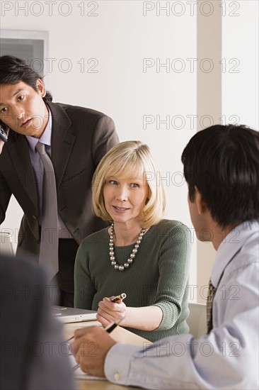 Business people at meeting. Photo : Rob Lewine