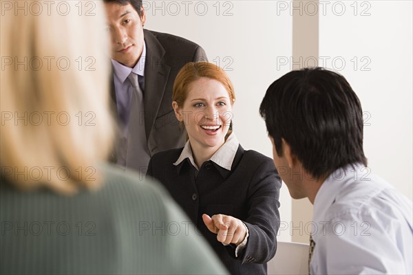 Business people at meeting. Photo : Rob Lewine