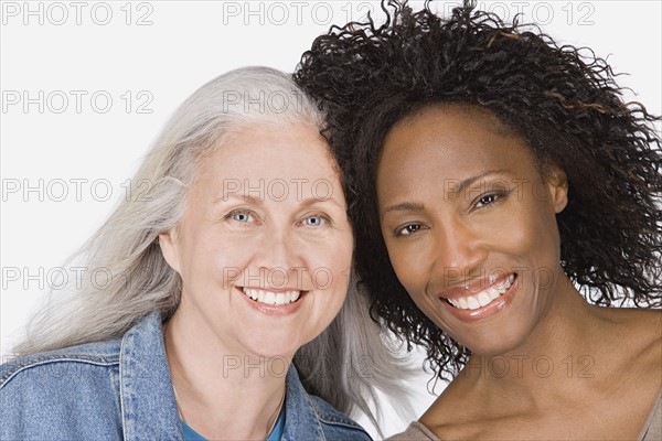 Studio portrait of two mature women. Photo : Rob Lewine