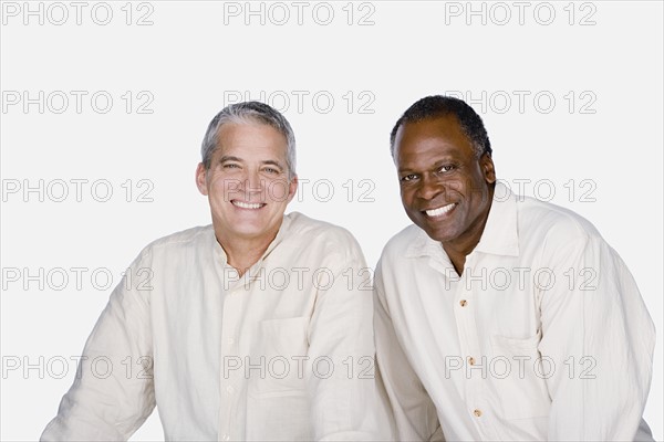 Studio portrait of two mature men. Photo : Rob Lewine