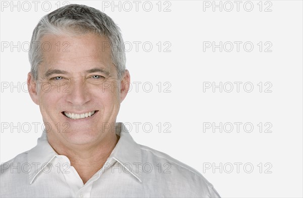 Studio portrait of mature man. Photo : Rob Lewine