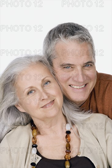 Studio portrait of mature couple. Photo : Rob Lewine