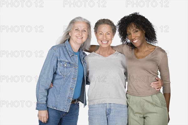 Studio portrait of three mature women. Photo : Rob Lewine