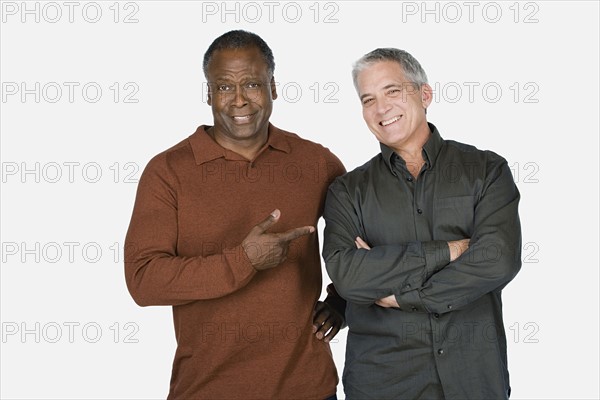 Studio portrait of two mature men. Photo : Rob Lewine