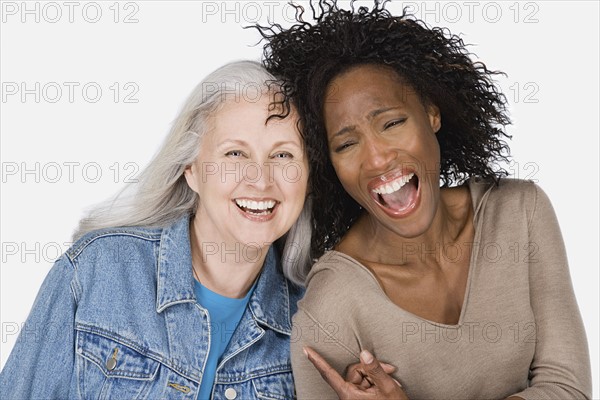 Studio portrait of two mature women. Photo : Rob Lewine