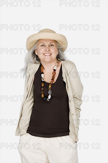 Studio portrait of mature woman wearing hat. Photo : Rob Lewine