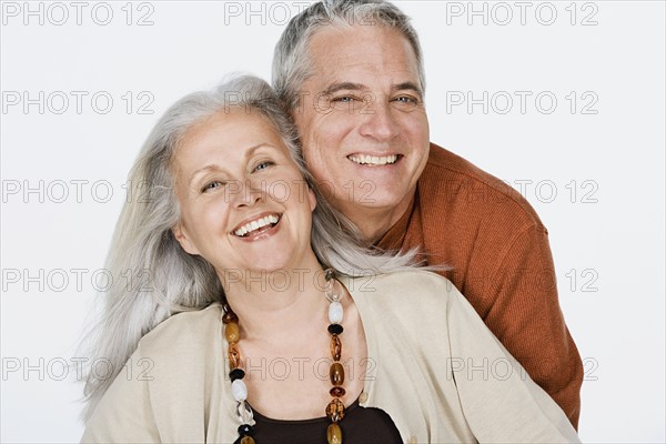 Studio portrait of mature couple. Photo : Rob Lewine
