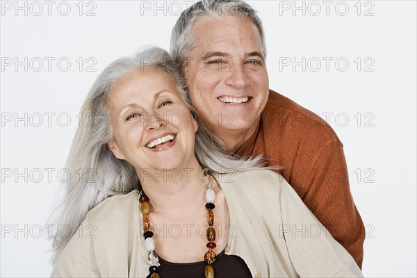 Studio portrait of mature couple. Photo: Rob Lewine