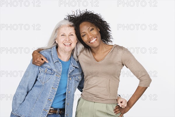 Studio portrait of two mature women. Photo : Rob Lewine