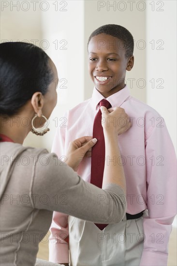 Mother adjusting Son's (12-13) tie. Photo : Rob Lewine