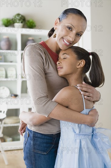 Mother and Daughter (10-11) hugging. Photo : Rob Lewine