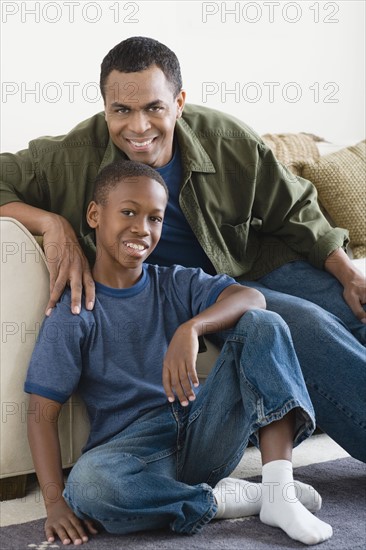 Portrait of Father and Son (12-13) at home. Photo : Rob Lewine