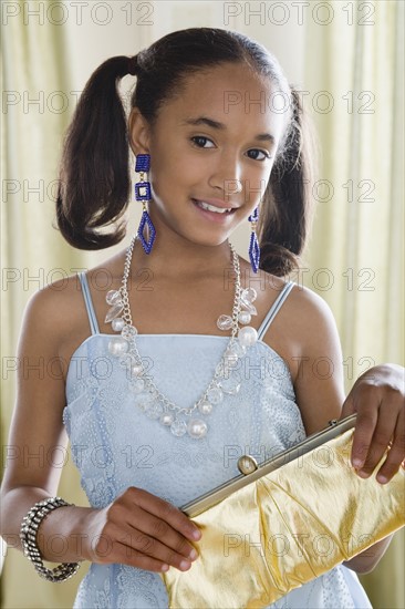 Portrait of girl (10-11) in elegant clothes. Photo : Rob Lewine