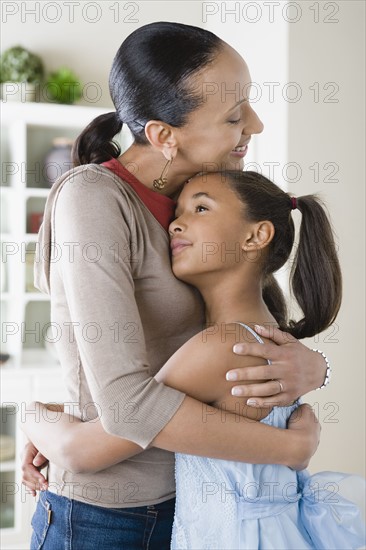 Mother and Daughter (10-11) hugging. Photo: Rob Lewine