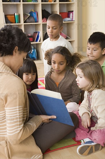 Teacher and children (6-7) at school. Photo : Rob Lewine