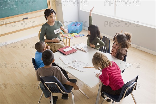 Teacher and children (6-7) at school. Photo : Rob Lewine