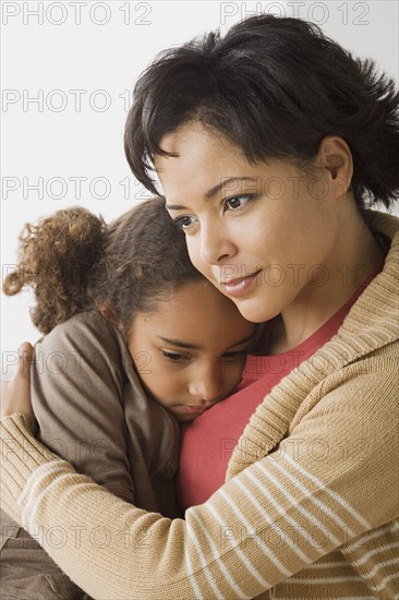 Teacher comforting girl (6-7). Photo: Rob Lewine