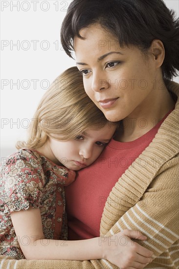 Teacher comforting girl (6-7). Photo : Rob Lewine