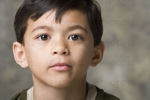 Portrait of boy (8-9), studio shot. Photo : Rob Lewine