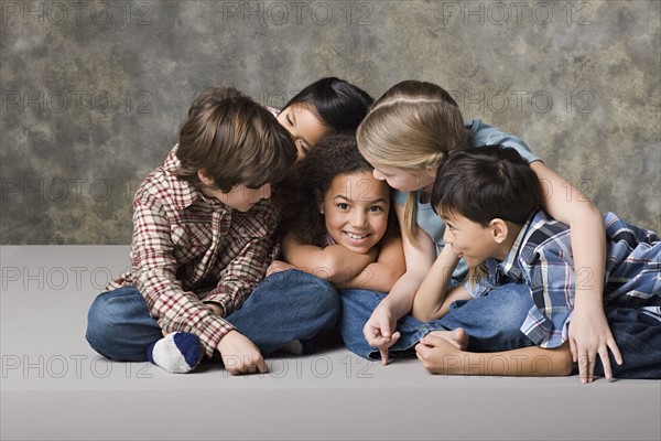 Children (6-7, 8-9) playing together, studio shot. Photo : Rob Lewine