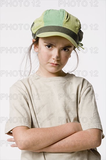 Studio portrait of sly girl (8-9). Photo : Rob Lewine