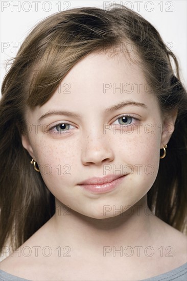 Studio portrait of girl (8-9), close up. Photo: Rob Lewine