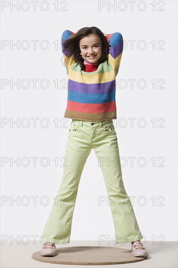 Studio portrait of smiling girl (8-9). Photo: Rob Lewine