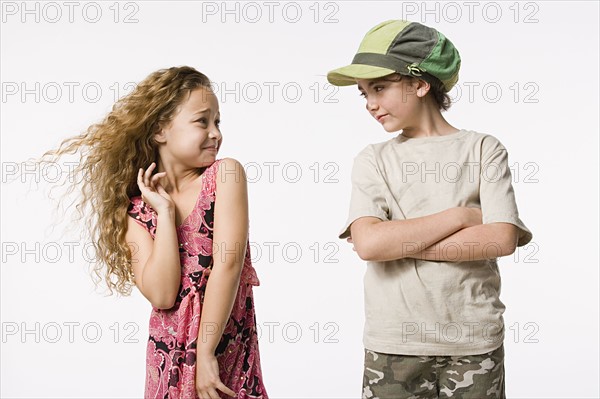 Studio portrait of two smiling girls (8-9) . Photo : Rob Lewine