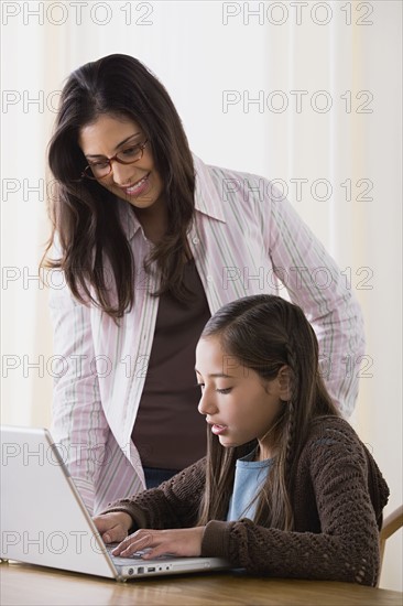 Mother doing homework with daughter (10-11). Photo: Rob Lewine