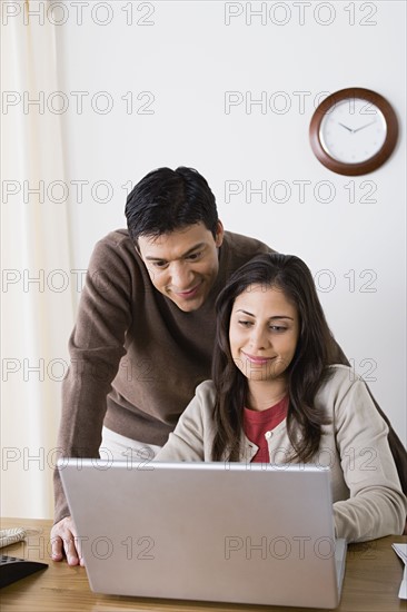 Couple doing paperwork at home. Photo : Rob Lewine