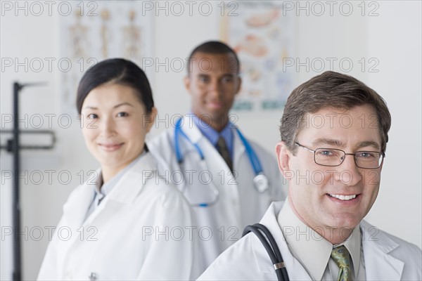 Group portrait of smiling doctors. Photo : Rob Lewine