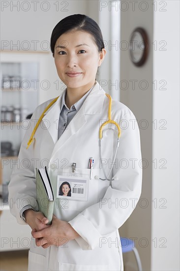 Portrait of smiling female doctor. Photo : Rob Lewine