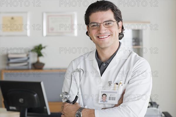 Portrait of smiling male doctor. Photo : Rob Lewine