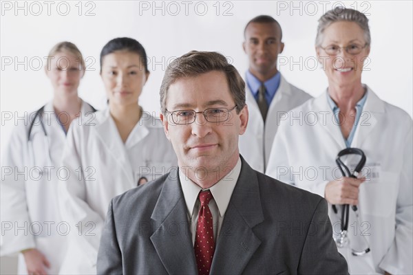 Group portrait of smiling doctors. Photo: Rob Lewine