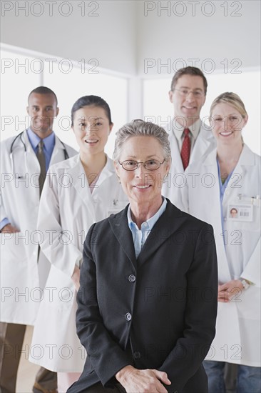 Group portrait of smiling doctors. Photo: Rob Lewine